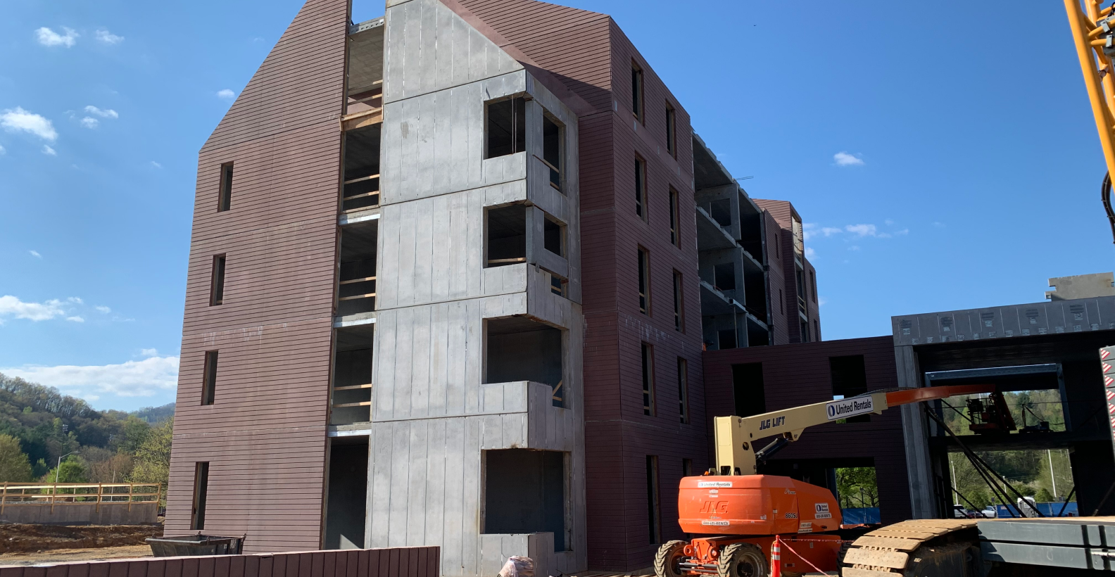 New construction site of a modern commercial building made of pre-cast concrete, showcasing progress and innovation.