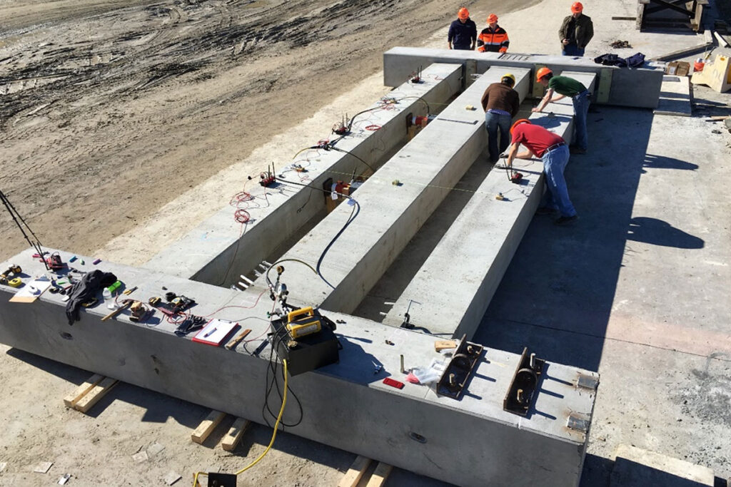 A real-life mockup of the ABC beam connections system laying down on the ground